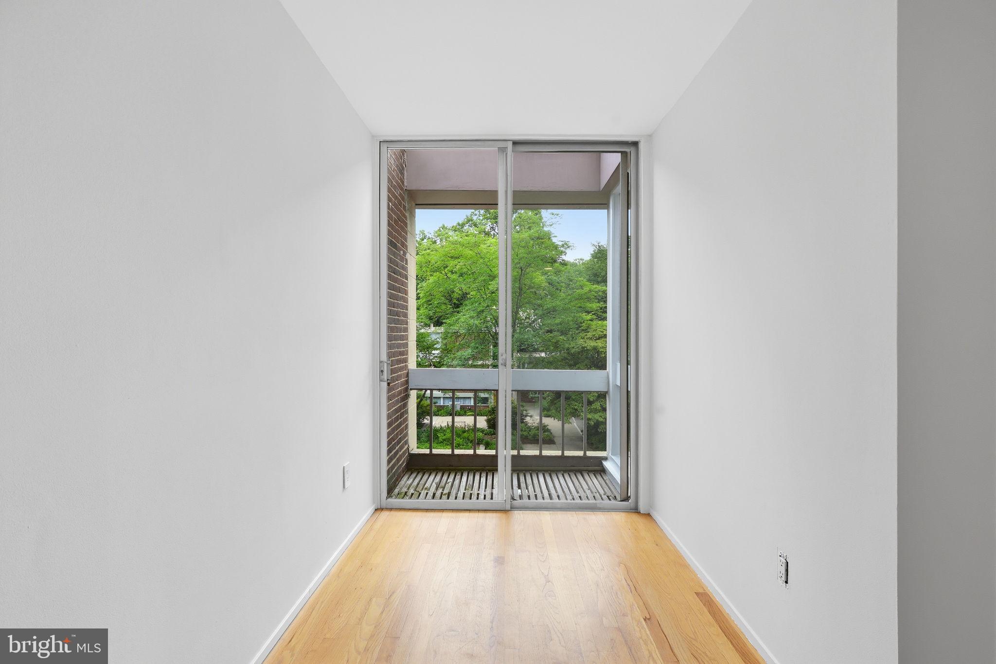11510 Maple Ridge Road Reston, VA 20190 - Photo 29 of 43 a view of a room with wooden floor and a window