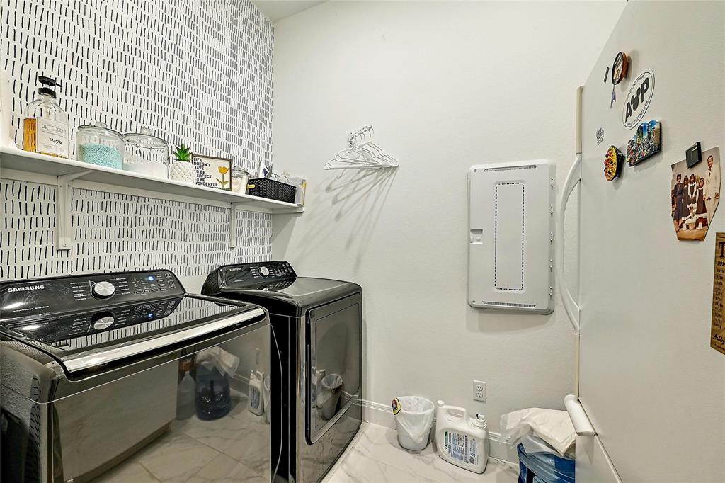170 Climbing Rock Loop Dripping Springs, TX 78620 - Photo 19 of 30 A well-organized utility room features a convenient washer and dryer set, enhancing daily routines.