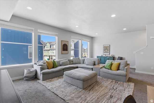 370 West Knights Lane Layton, UT 84041 - Photo 16 of 31 Bright living area featuring recessed lighting, a neutral color palette, multiple large windows, and carpet flooring