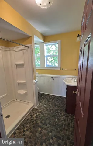 a kitchen with a sink stove and refrigerator