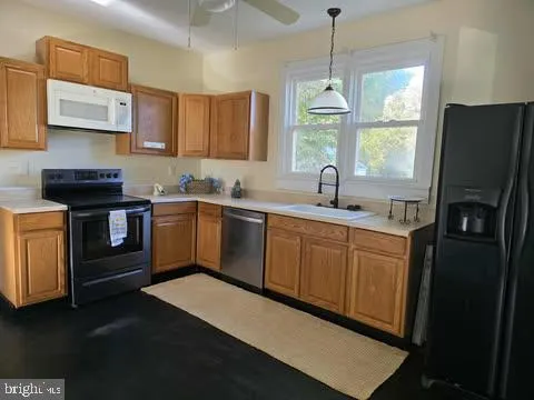 a bed sitting in a window next to a window