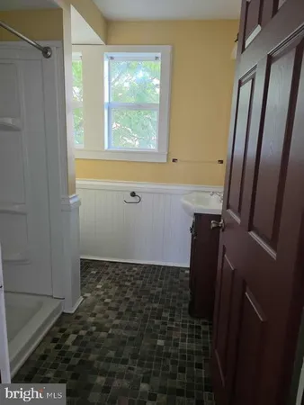 a view of a dining room with furniture and window