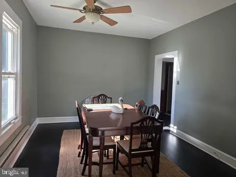 a view of a dining room with furniture and window