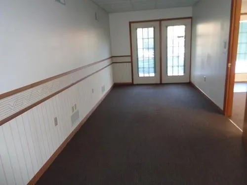 a view of a hallway with windows