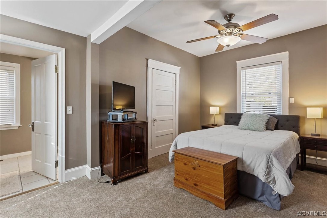 708 Hamilton Avenue Colonial Heights, VA 23834 - Photo 15 of 32 a spacious bedroom with a bed and a chandelier