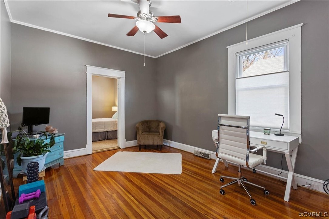 708 Hamilton Avenue Colonial Heights, VA 23834 - Photo 22 of 32 a bedroom with a bed and a chandelier
