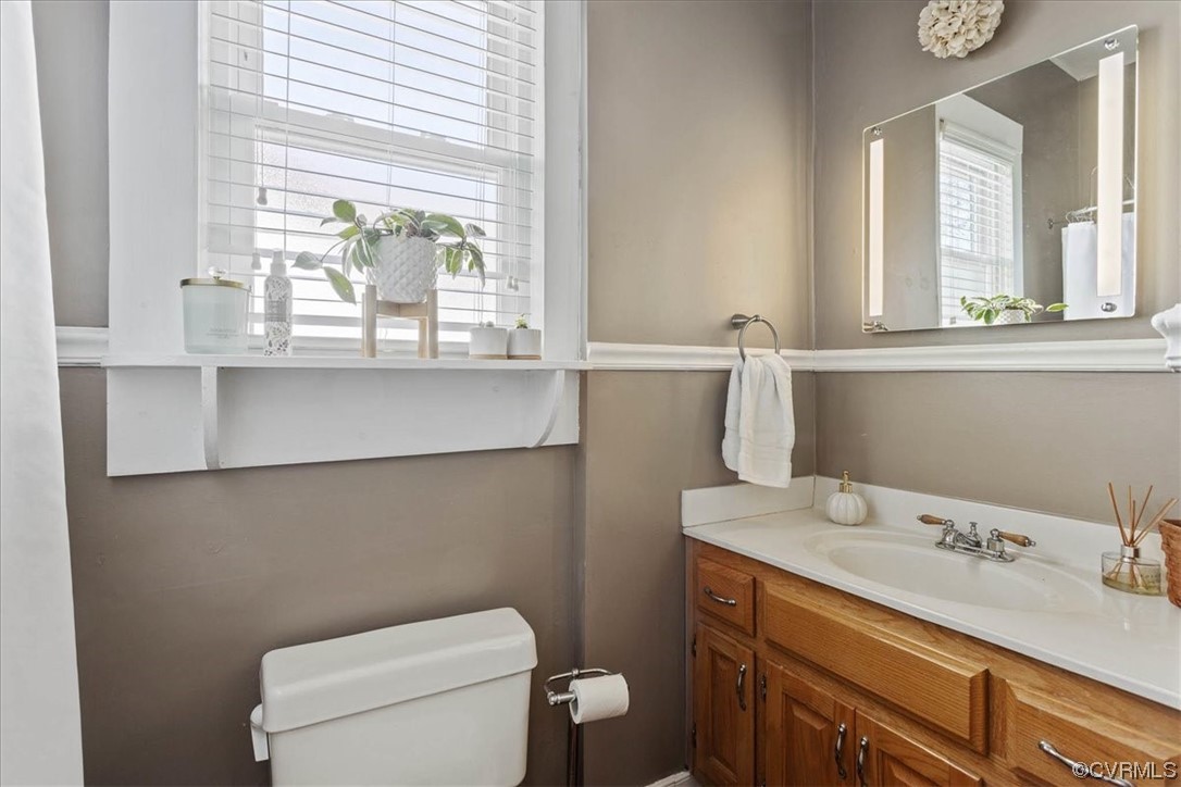 708 Hamilton Avenue Colonial Heights, VA 23834 - Photo 24 of 32 a bathroom with a sink a toilet and a window