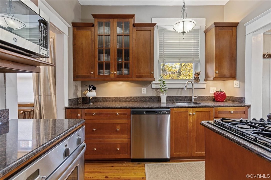 708 Hamilton Avenue Colonial Heights, VA 23834 - Photo 10 of 32 a kitchen with granite countertop stainless steel appliances and wooden cabinets