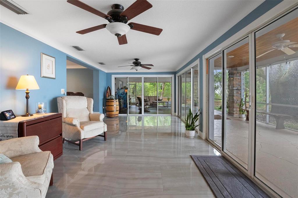 250 Brigham Road Northwest Winter Haven, FL 33881 - Photo 11 of 65 a living room with furniture and a large window