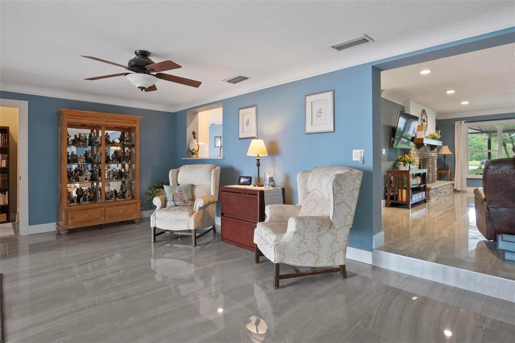 250 Brigham Road Northwest Winter Haven, FL 33881 - Photo 13 of 65 a living room with furniture and a window