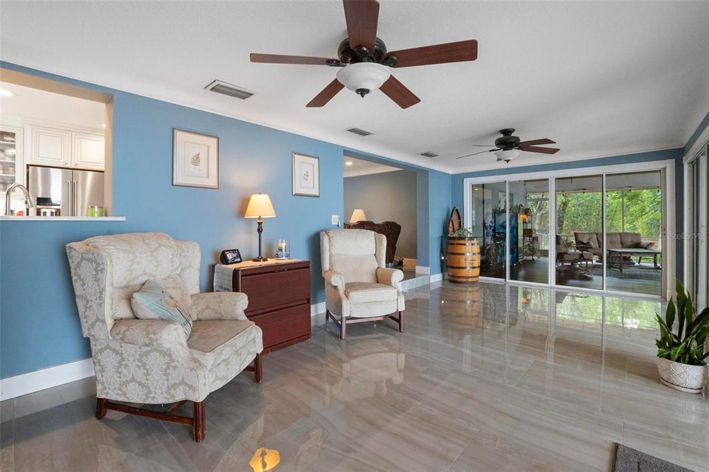 250 Brigham Road Northwest Winter Haven, FL 33881 - Photo 14 of 65 a living room with furniture and a large window