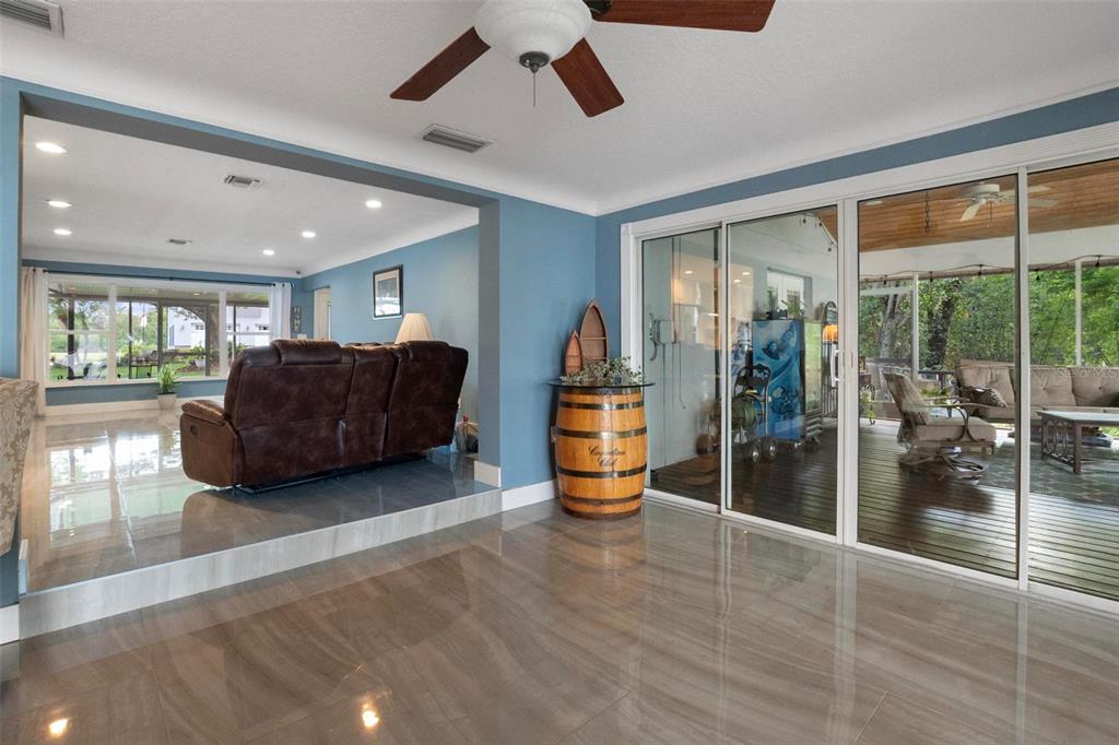 250 Brigham Road Northwest Winter Haven, FL 33881 - Photo 15 of 65 a living room with furniture and a large window