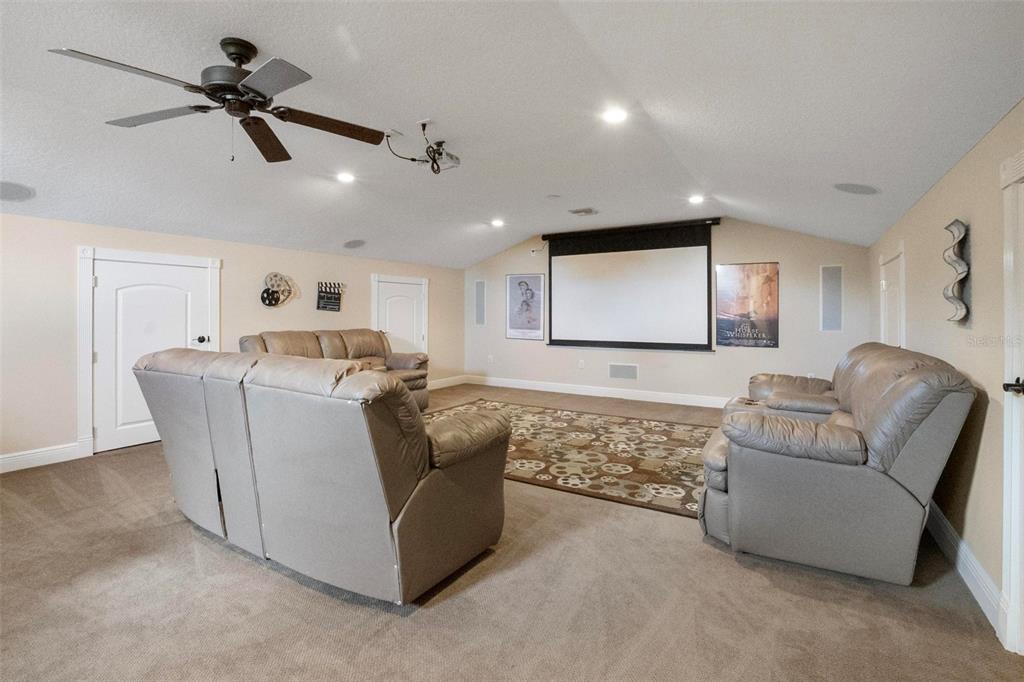 250 Brigham Road Northwest Winter Haven, FL 33881 - Photo 25 of 65 a living room with furniture and a ceiling fan