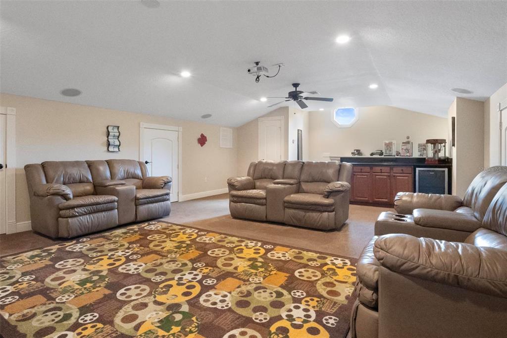 250 Brigham Road Northwest Winter Haven, FL 33881 - Photo 26 of 65 a living room with furniture and a rug