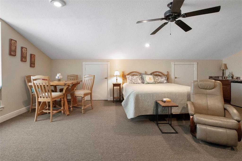 250 Brigham Road Northwest Winter Haven, FL 33881 - Photo 54 of 65 a bedroom with furniture and a ceiling fan