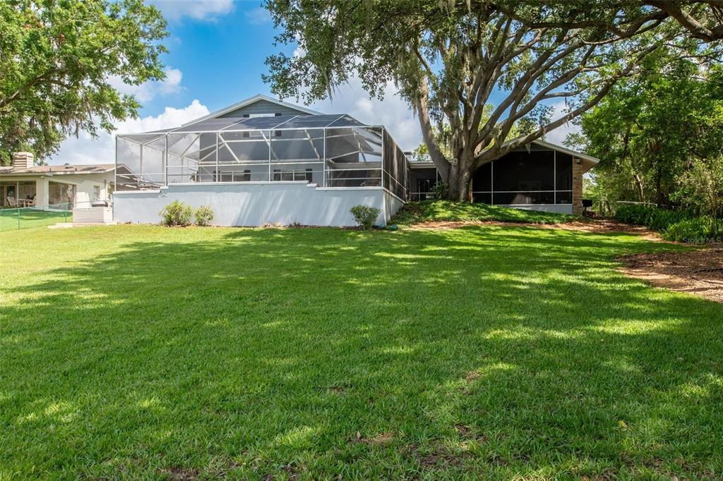 250 Brigham Road Northwest Winter Haven, FL 33881 - Photo 60 of 65 a front view of a house with a garden