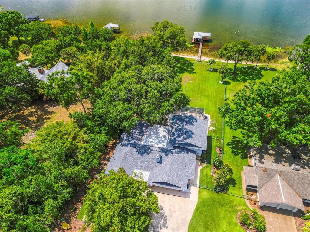 250 Brigham Road Northwest Winter Haven, FL 33881 - Photo 61 of 65 an aerial view of a house with a yard lake house and outdoor seating