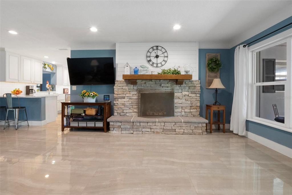250 Brigham Road Northwest Winter Haven, FL 33881 - Photo 7 of 65 a living room with furniture and a flat screen tv