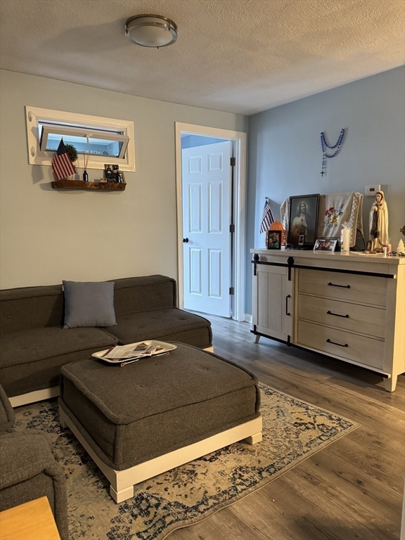 358 Broadway, Unit 13 Lynn, MA 01904 - Photo 13 of 26 a living room with furniture