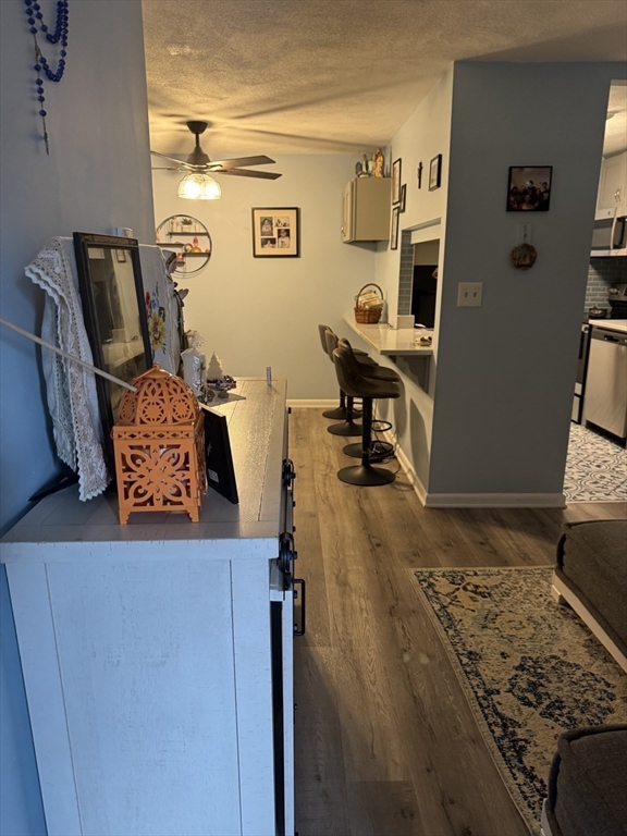 358 Broadway, Unit 13 Lynn, MA 01904 - Photo 14 of 26 a view of a living room with furniture and a rug