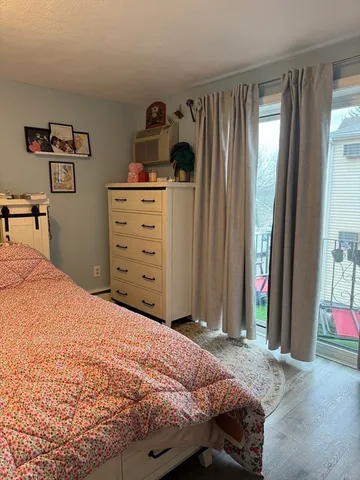 a bedroom with a bed and a cabinets
