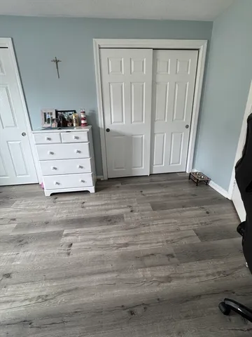 a view of wooden floor and cabinet