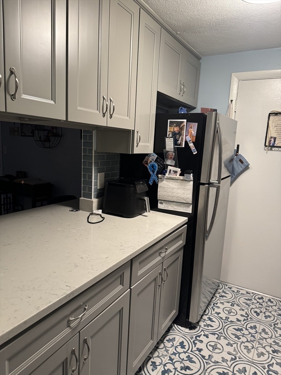 358 Broadway, Unit 13 Lynn, MA 01904 - Photo 8 of 26 a kitchen with a sink and cabinets