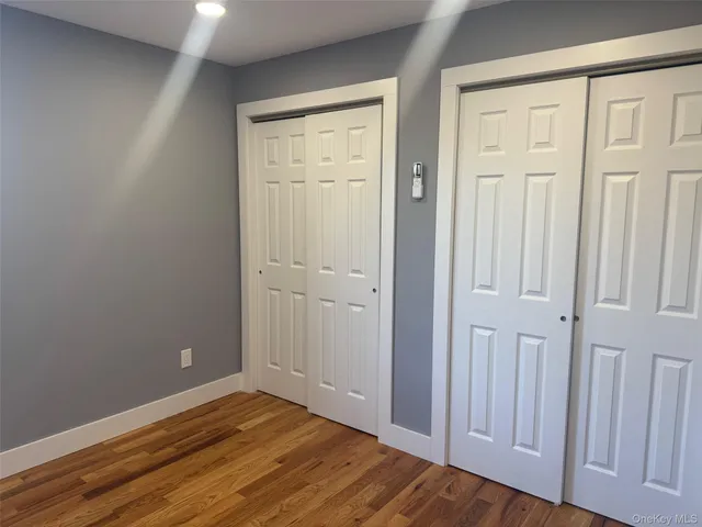 an empty room with wooden floor