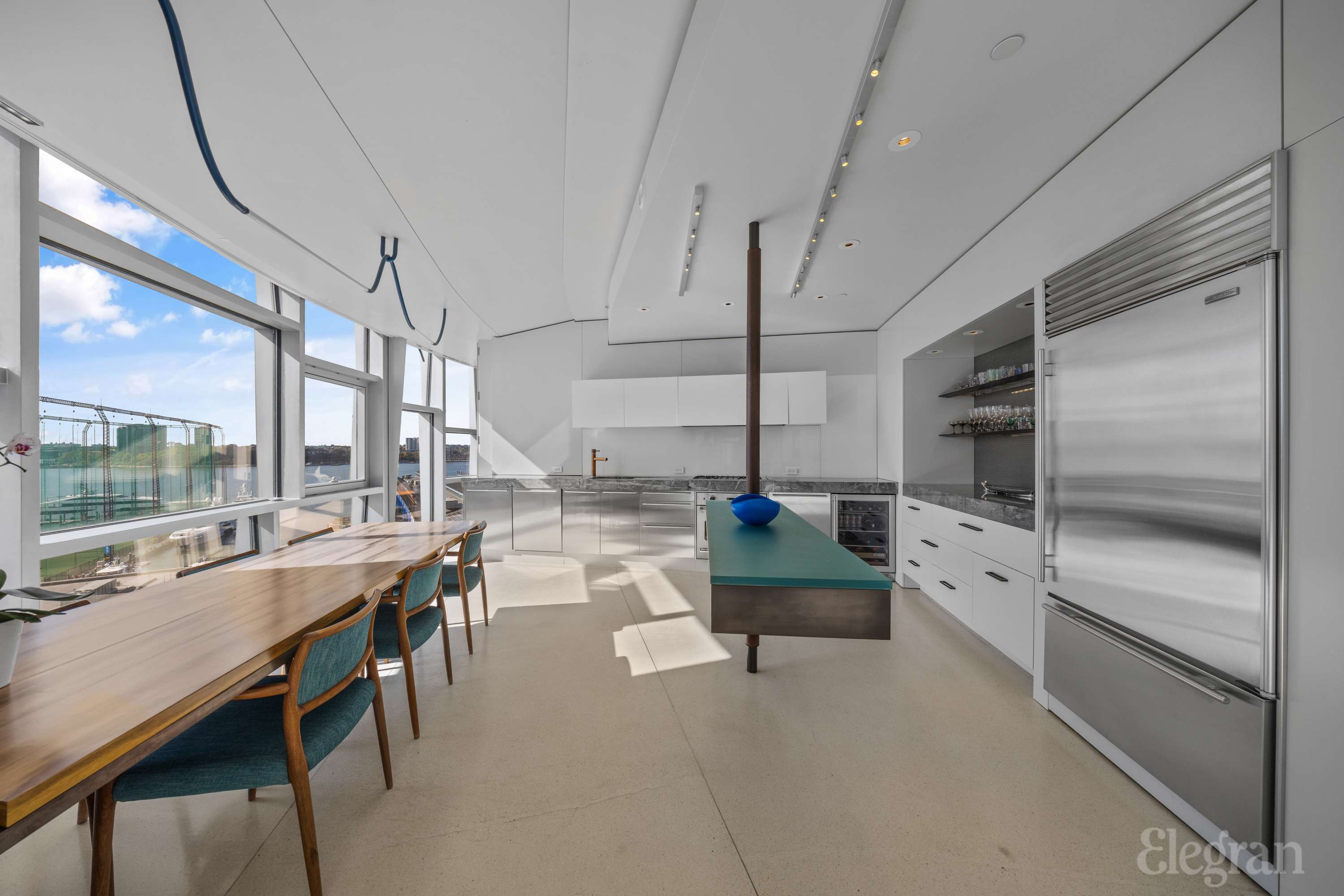 100 11th Avenue, Unit 11B Manhattan, NY 10011 - Photo 2 of 19 a room with lots of table and chairs