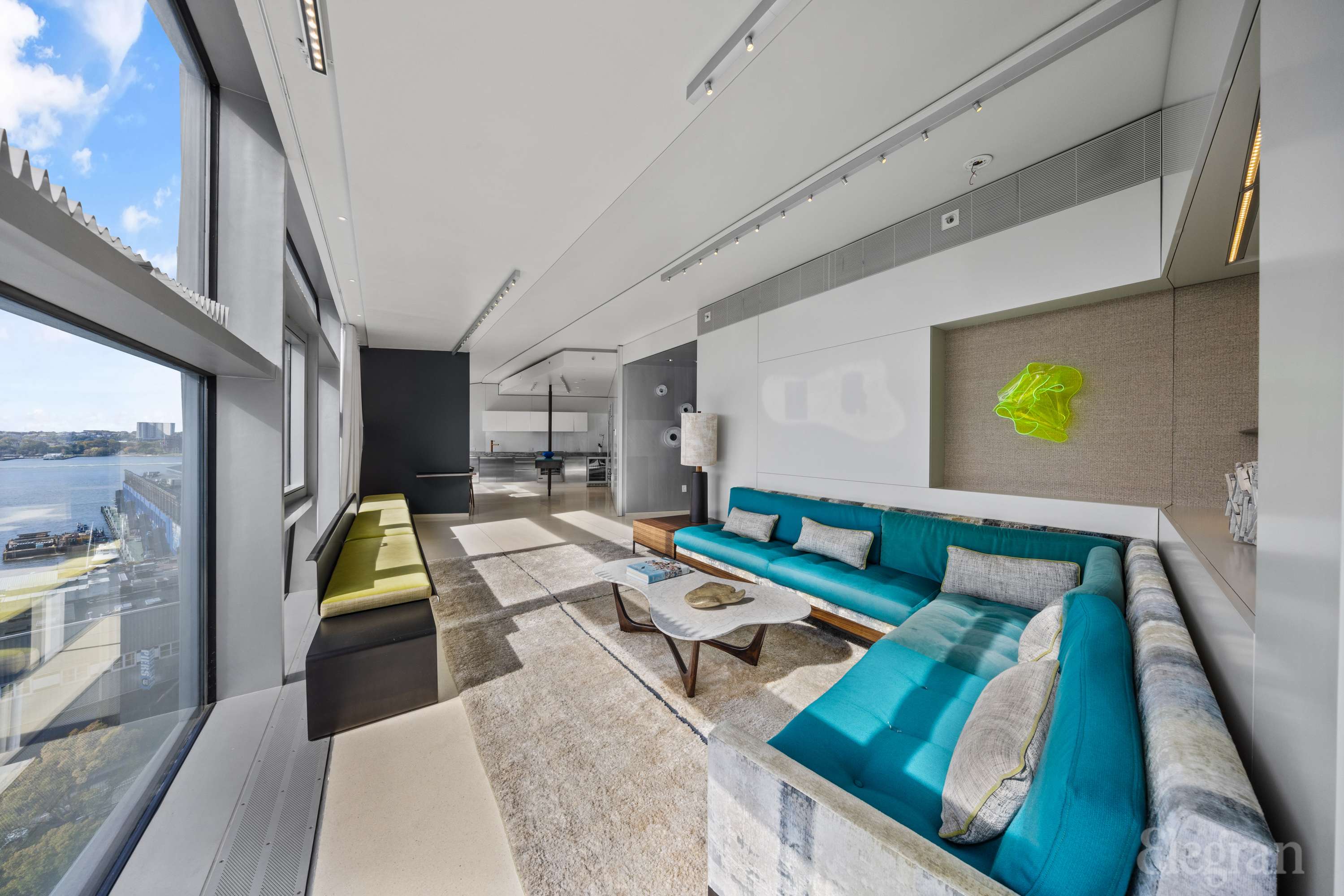 100 11th Avenue, Unit 11B Manhattan, NY 10011 - Photo 4 of 19 a living room with furniture and a table