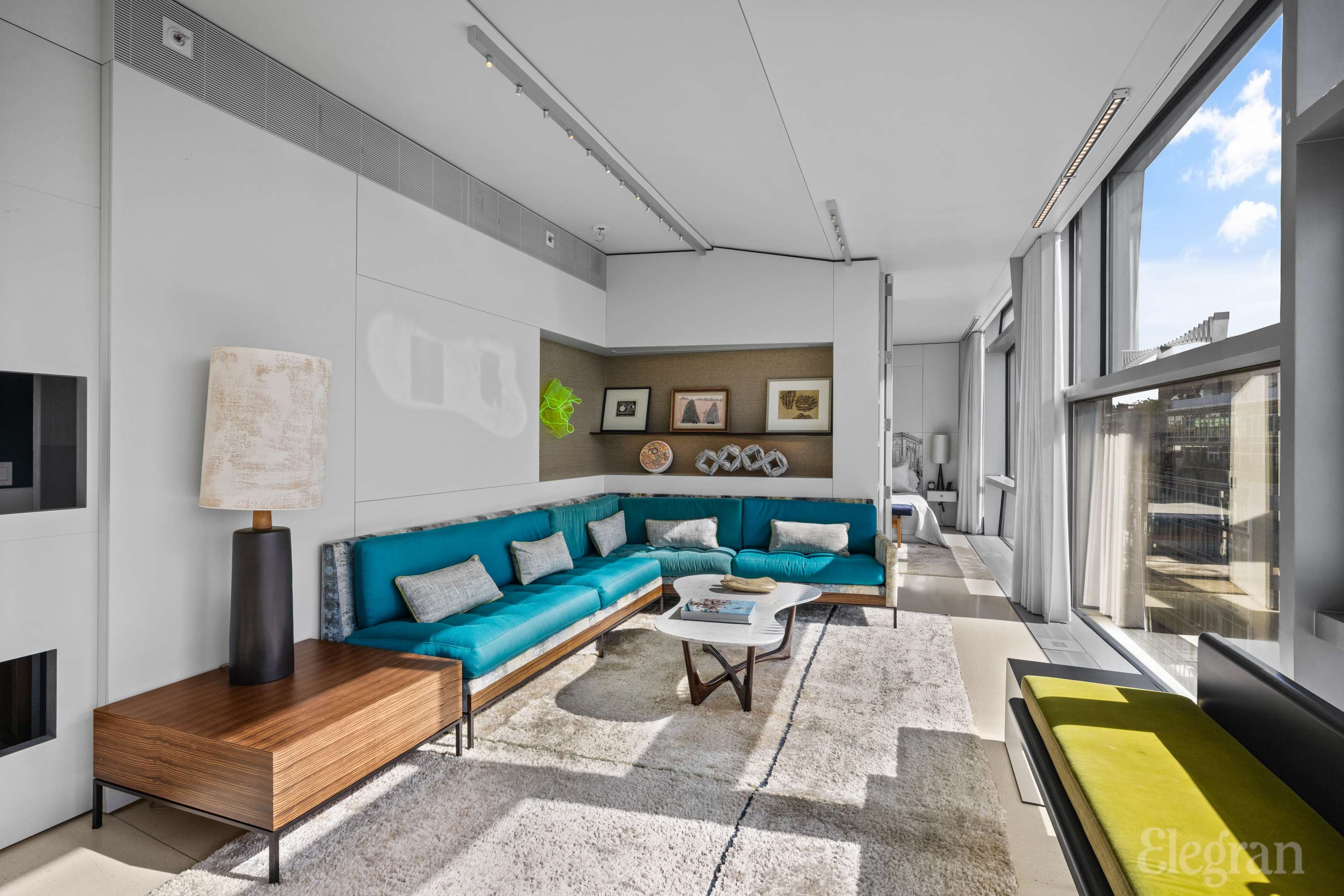 100 11th Avenue, Unit 11B Manhattan, NY 10011 - Photo 6 of 19 a living room with furniture and a rug