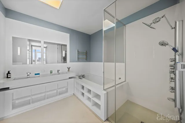 a bedroom with a bed and a large window with chair