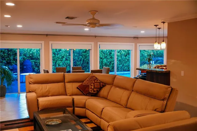 a living room with furniture and a large window