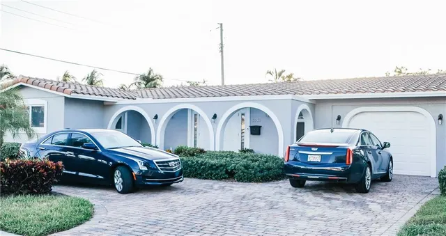 a car parked in front of a house