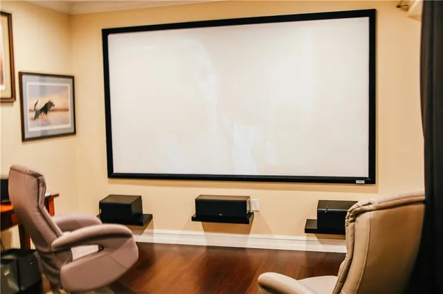a living room with couches and a flat screen tv