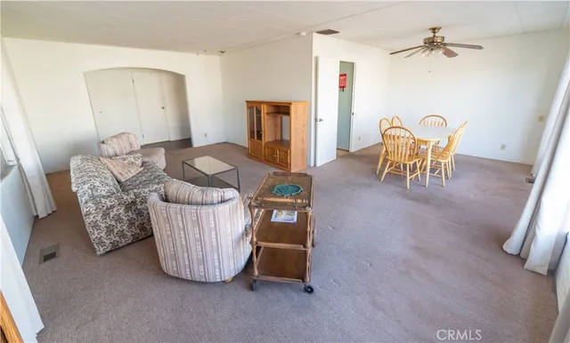 a living room with furniture and a table