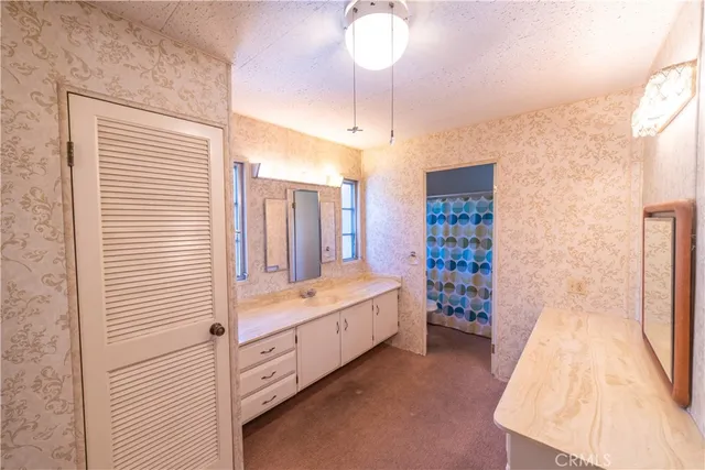 a bathroom with a double vanity sink and mirror