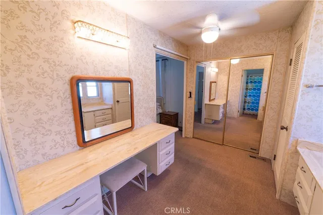 a bathroom with a sink a mirror and a shower