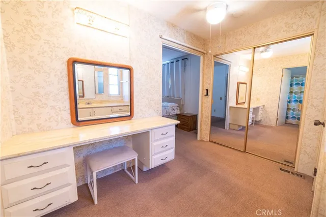 a room with a chair and a dresser