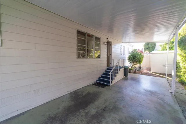 a view of a backyard with stairs and a garden