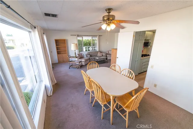 a view of a livingroom with furniture window and wooden floor