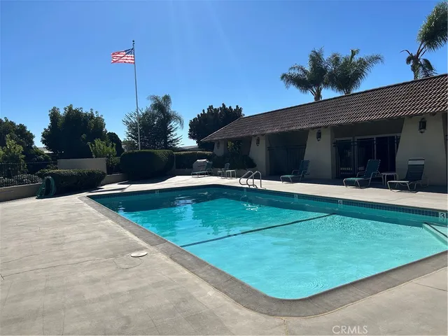 a view of a backyard with a patio and plants