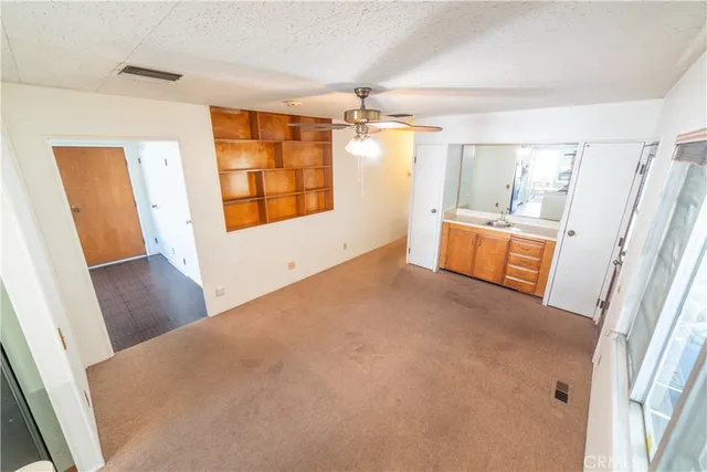 a view of a room with window and wooden floor