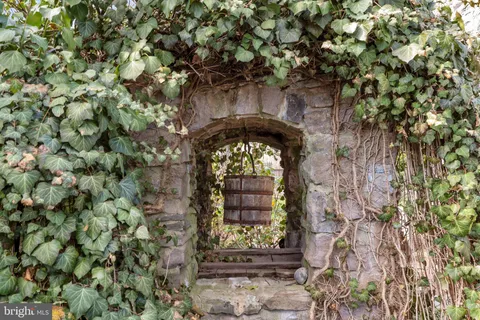 a front view of house with yard and swimming pool