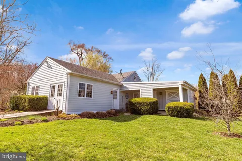 an aerial view of houses with yard