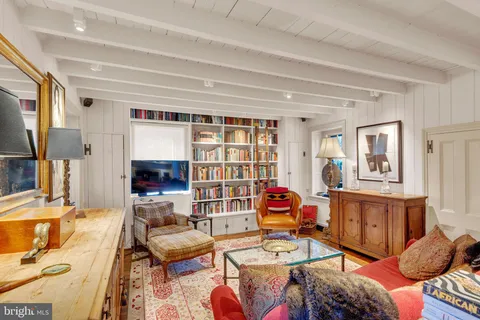 a living room with furniture workspace and a window