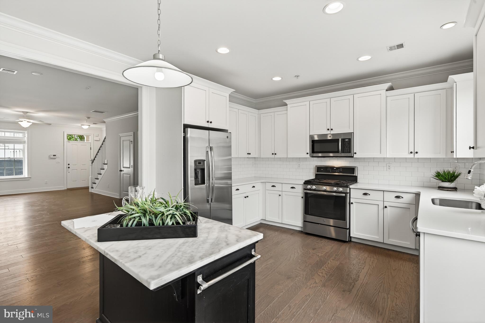 610 D Street Kennett Square, PA 19348 - Photo 4 of 24 Bright white kitchen with island