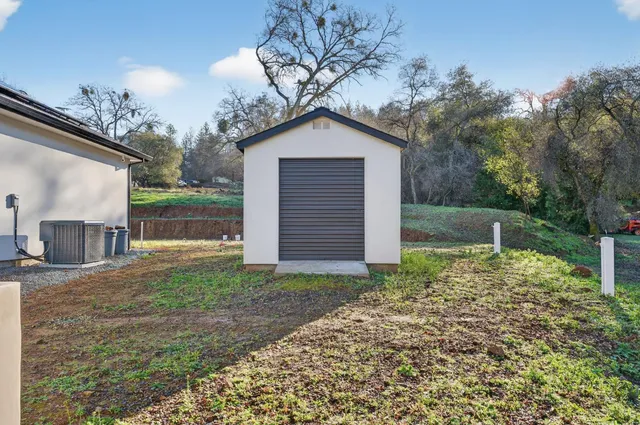 a house view with a backyard space