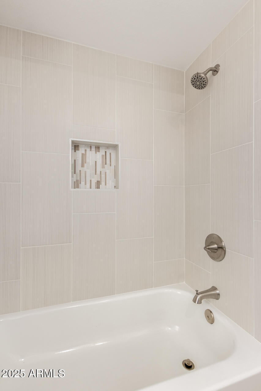 8635 South 48th Street, Unit 3 Phoenix, AZ 85044 - Photo 17 of 24 a bathroom with a bathtub