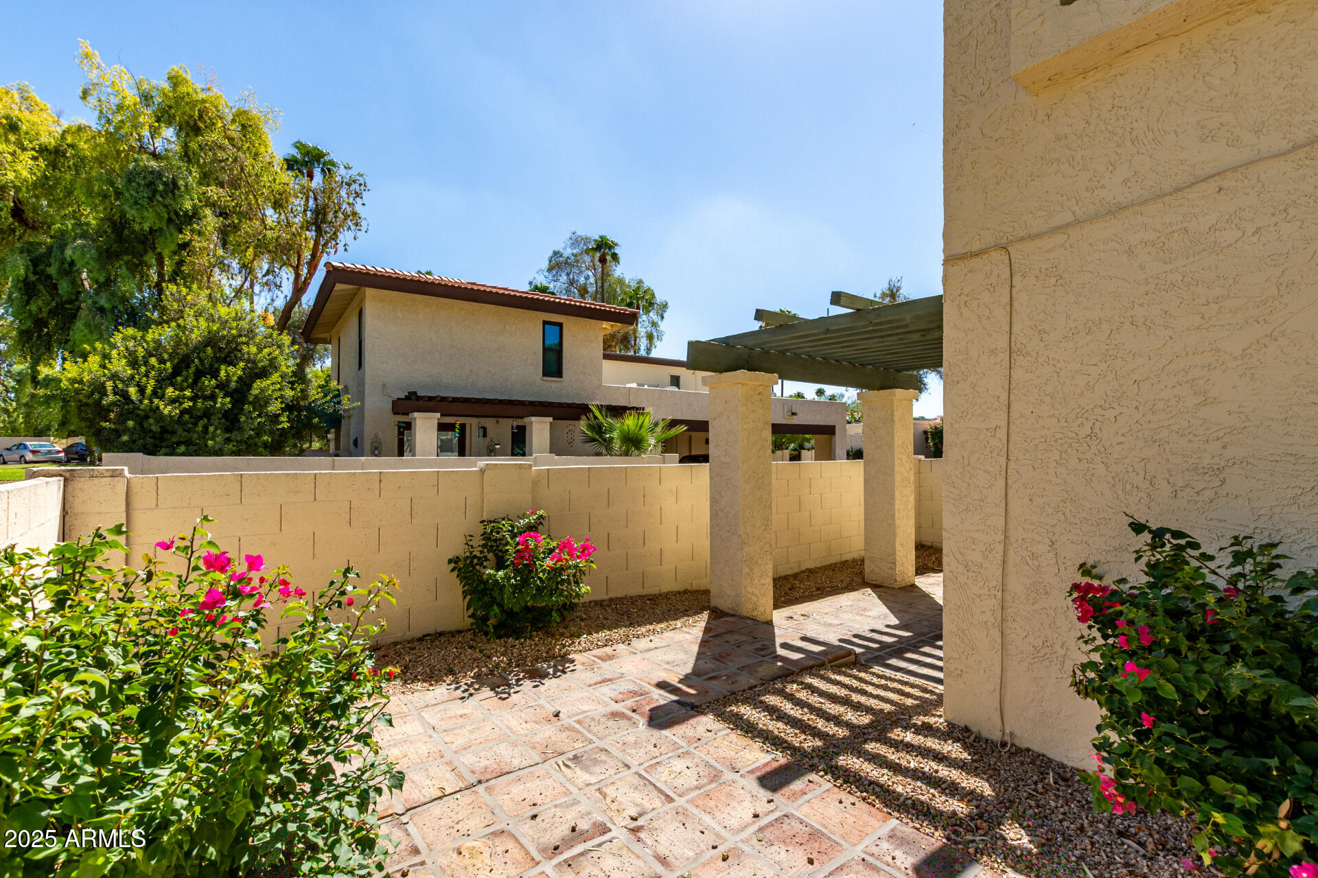 8635 South 48th Street, Unit 3 Phoenix, AZ 85044 - Photo 21 of 24 a front view of a house with a yard